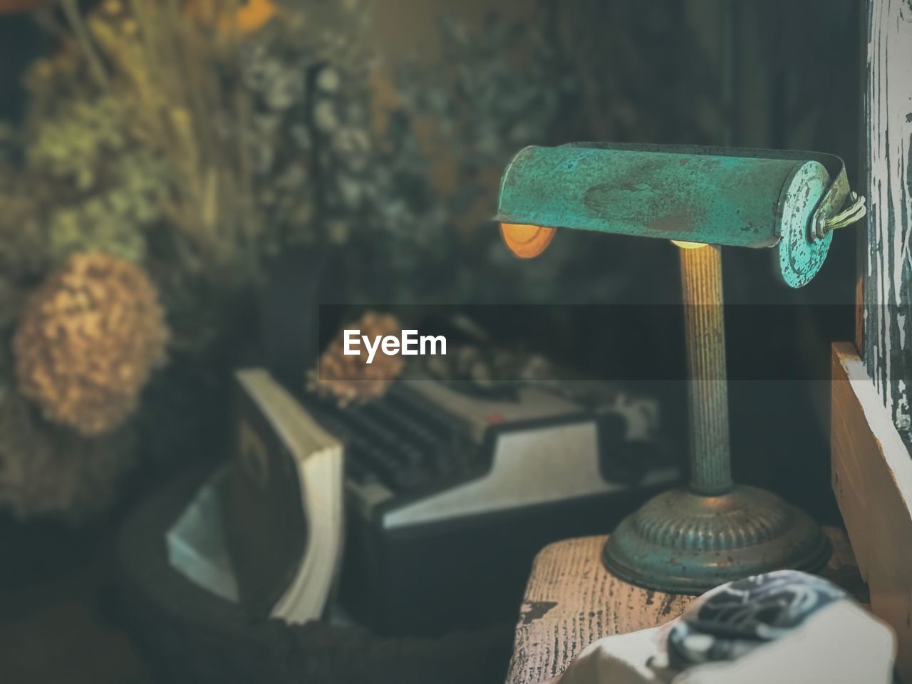 Close-up of old lighting equipment on table