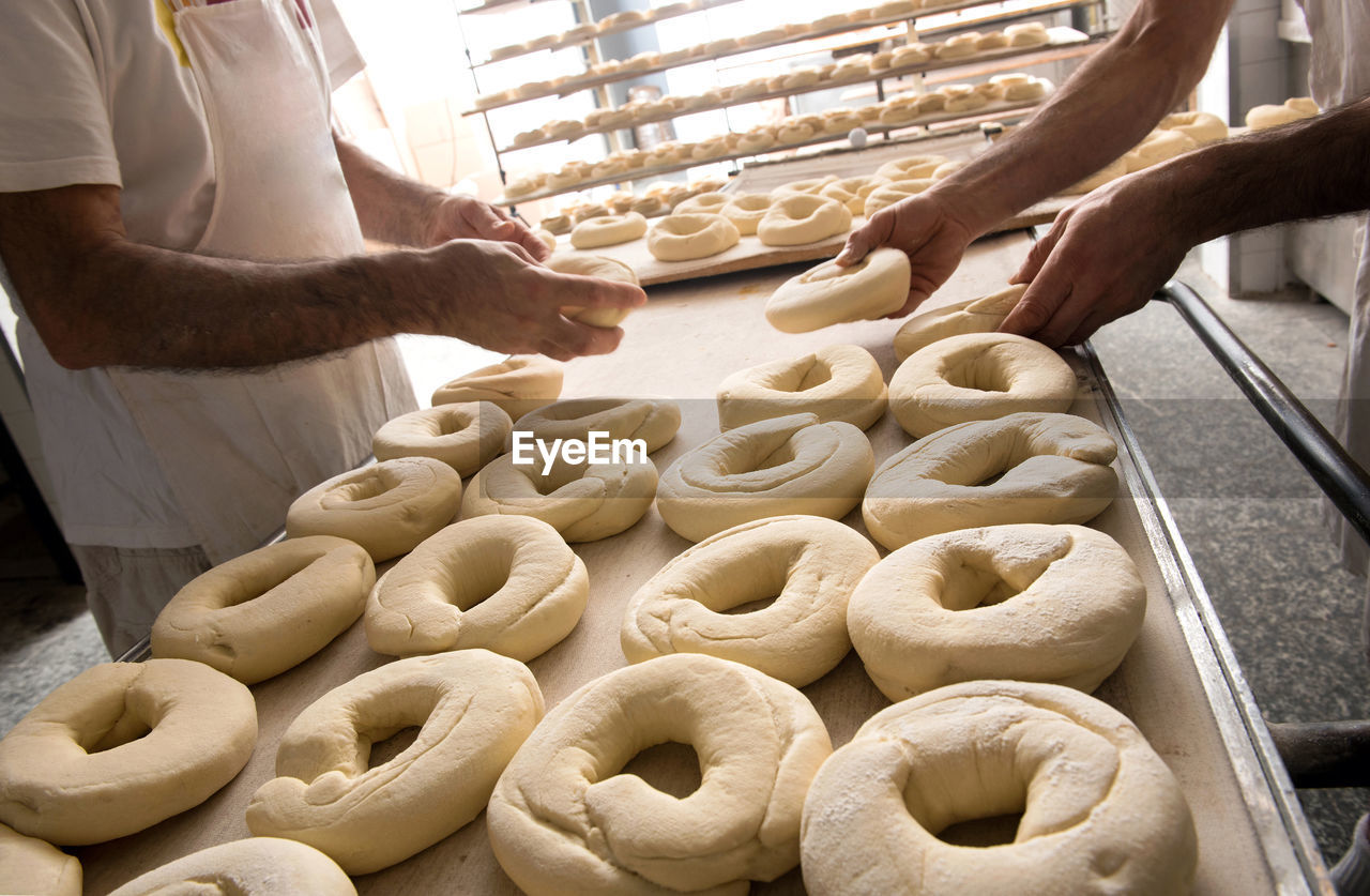 Bakers preparing dough for bagels