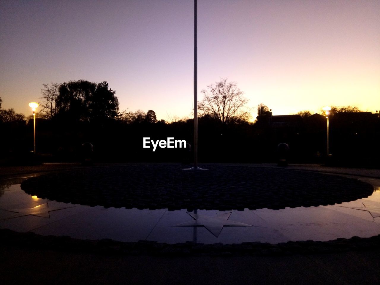 VIEW OF EMPTY STREET AT DUSK