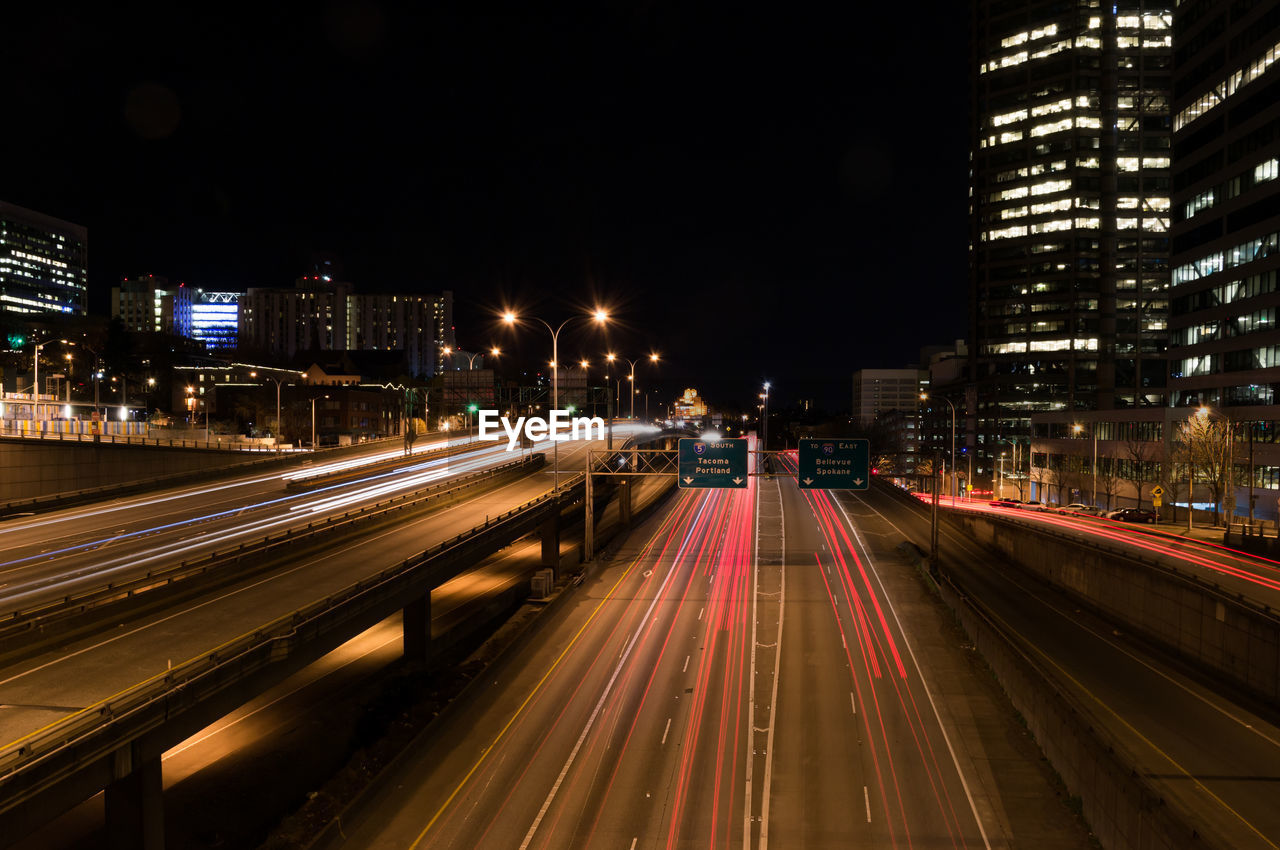 Illuminated city street at night