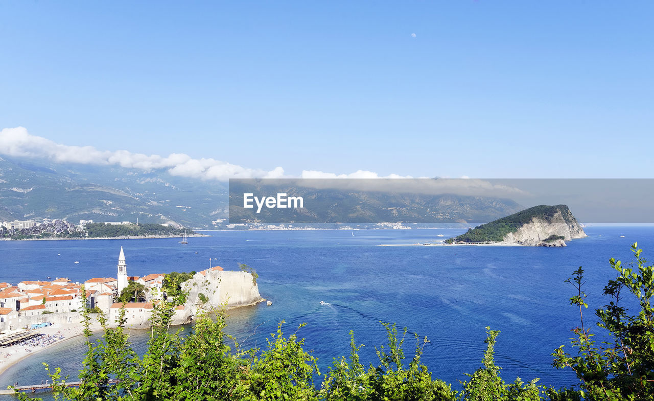 Scenic view of sea against blue sky