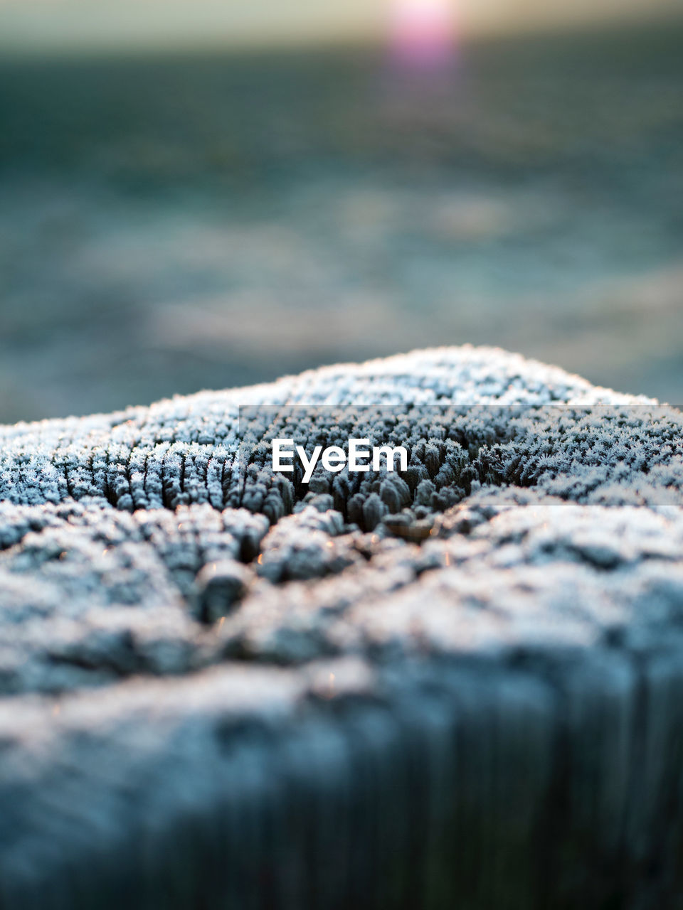 CLOSE-UP OF WATER SPLASHING ON BEACH