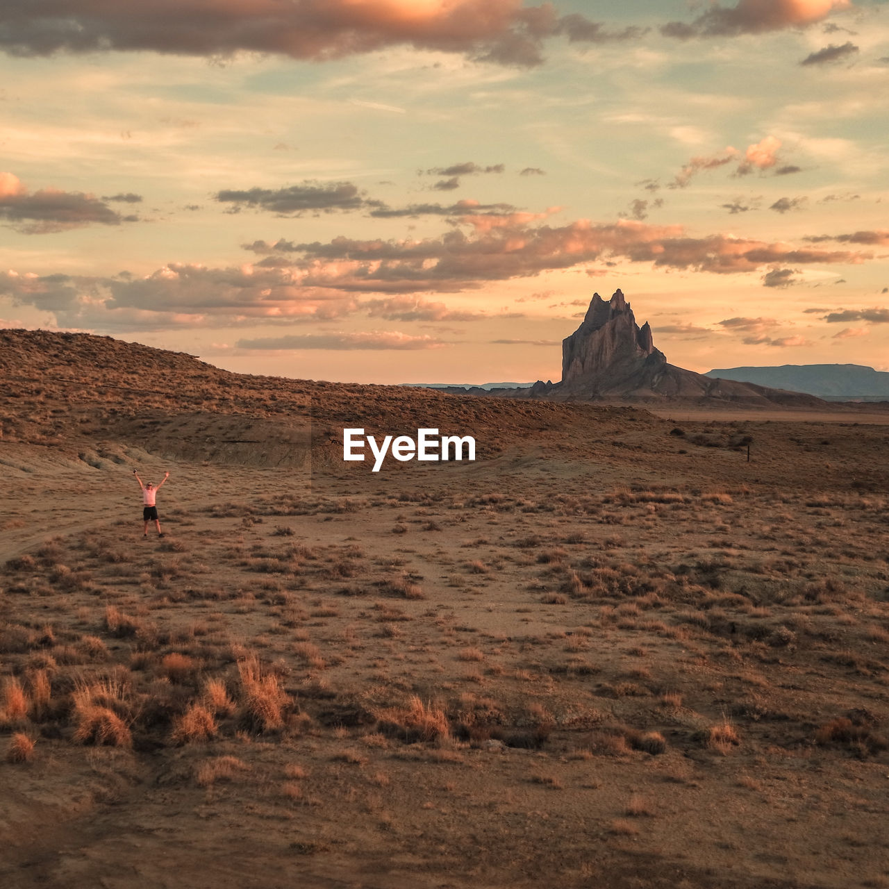 Rock formations on landscape against sky during sunset