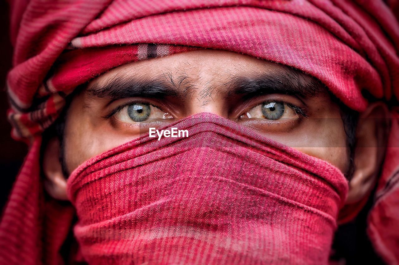 Close-up of man wearing headscarf