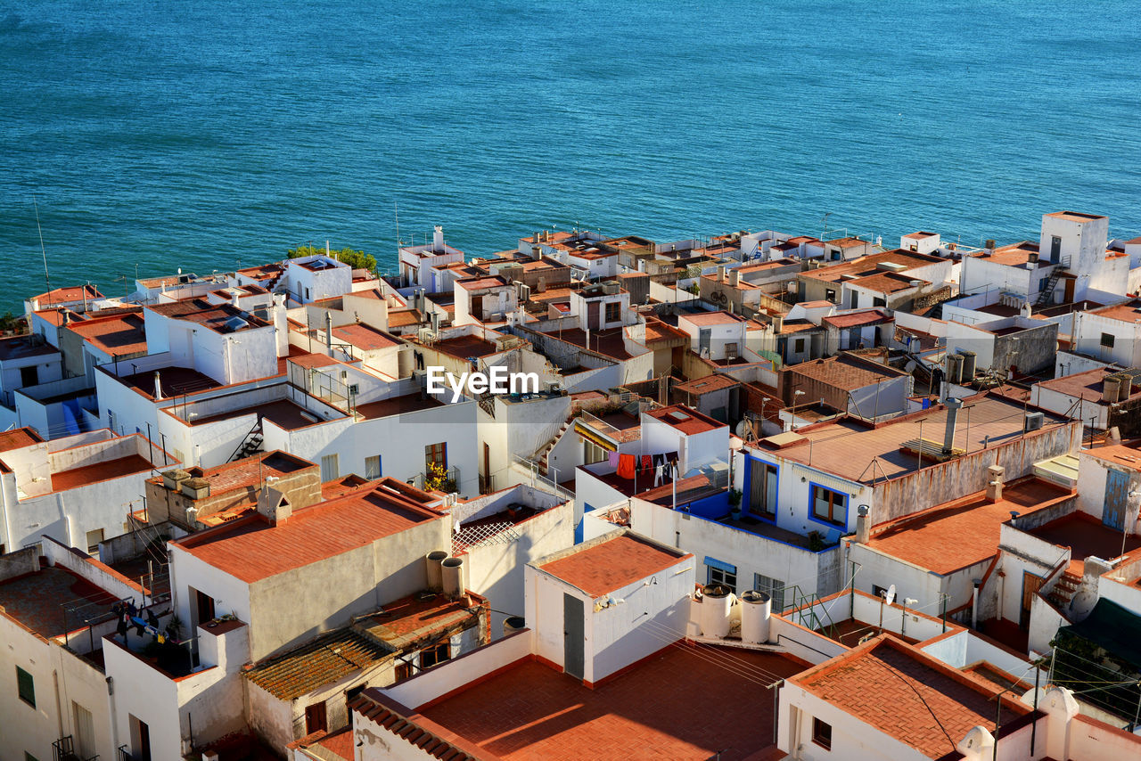 High angle view of houses by sea