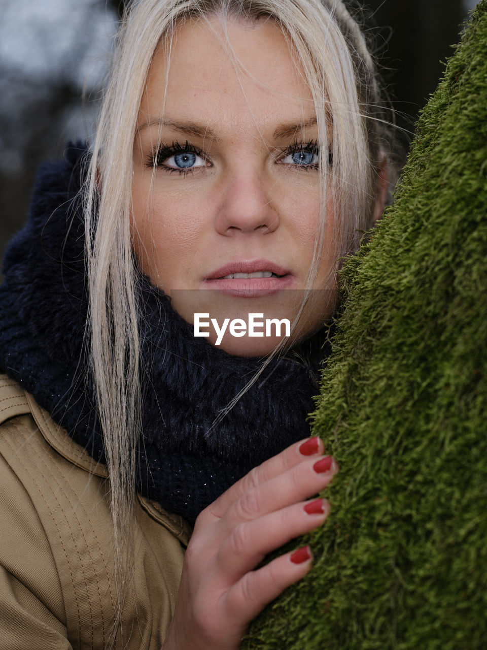 Portrait of a beautiful young woman with blue eyes and blond hair