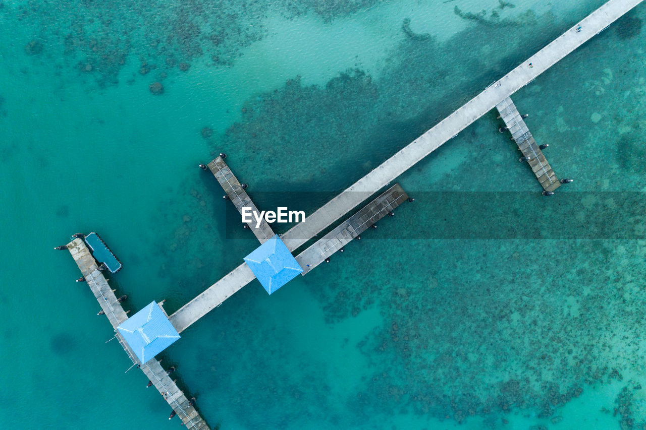 Directly above shot of built structures on pier in sea