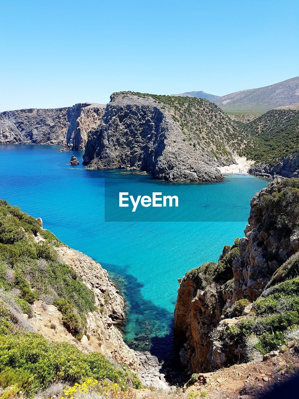 Scenic view of blue sea against clear sky