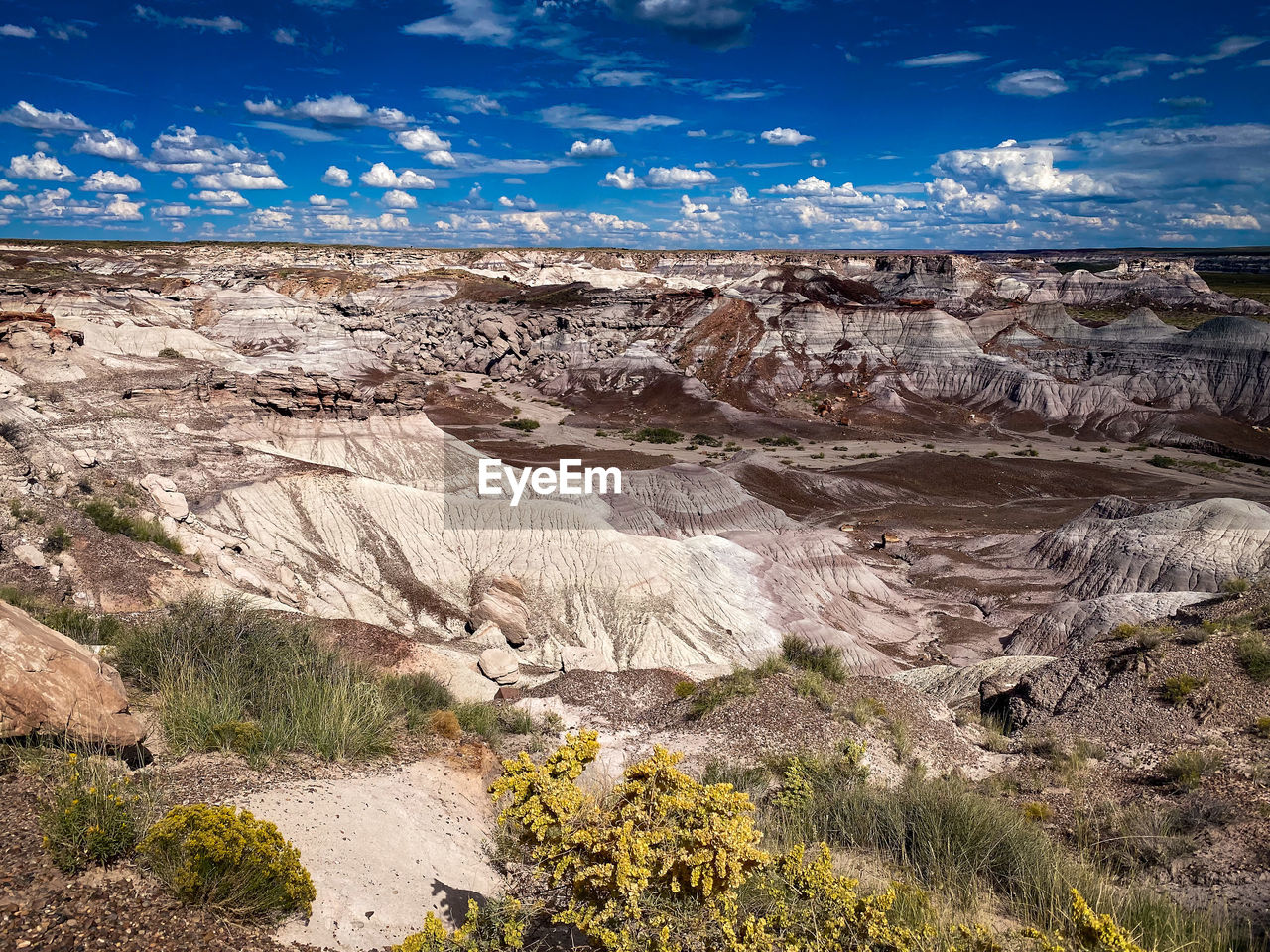 Scenic view of landscape against sky at petrified forest national park, united states.