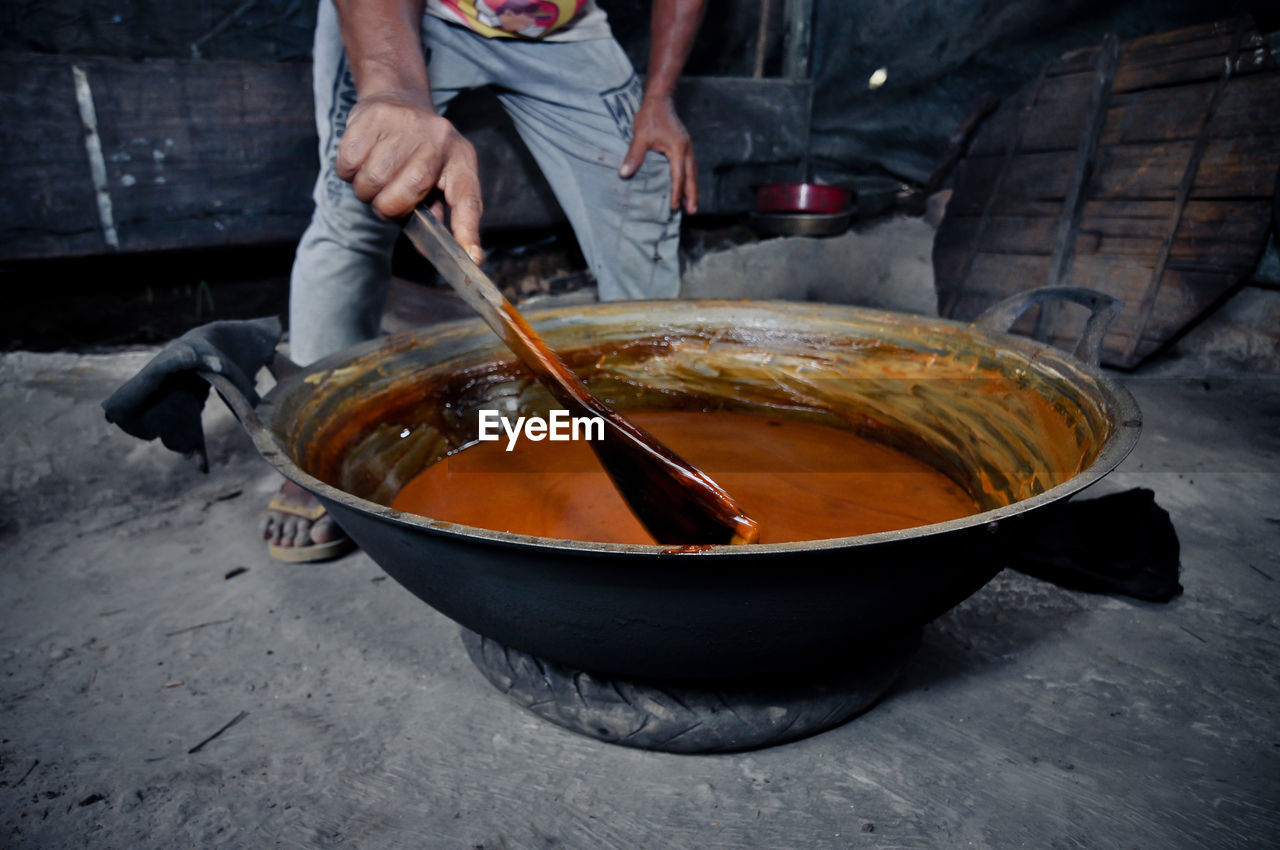 Midsection of man preparing food