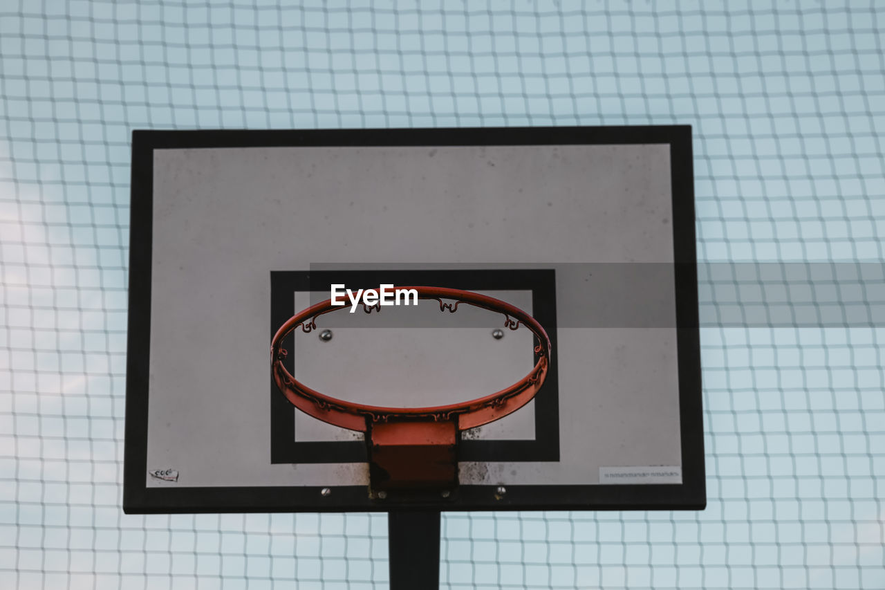 LOW ANGLE VIEW OF BASKETBALL HOOP