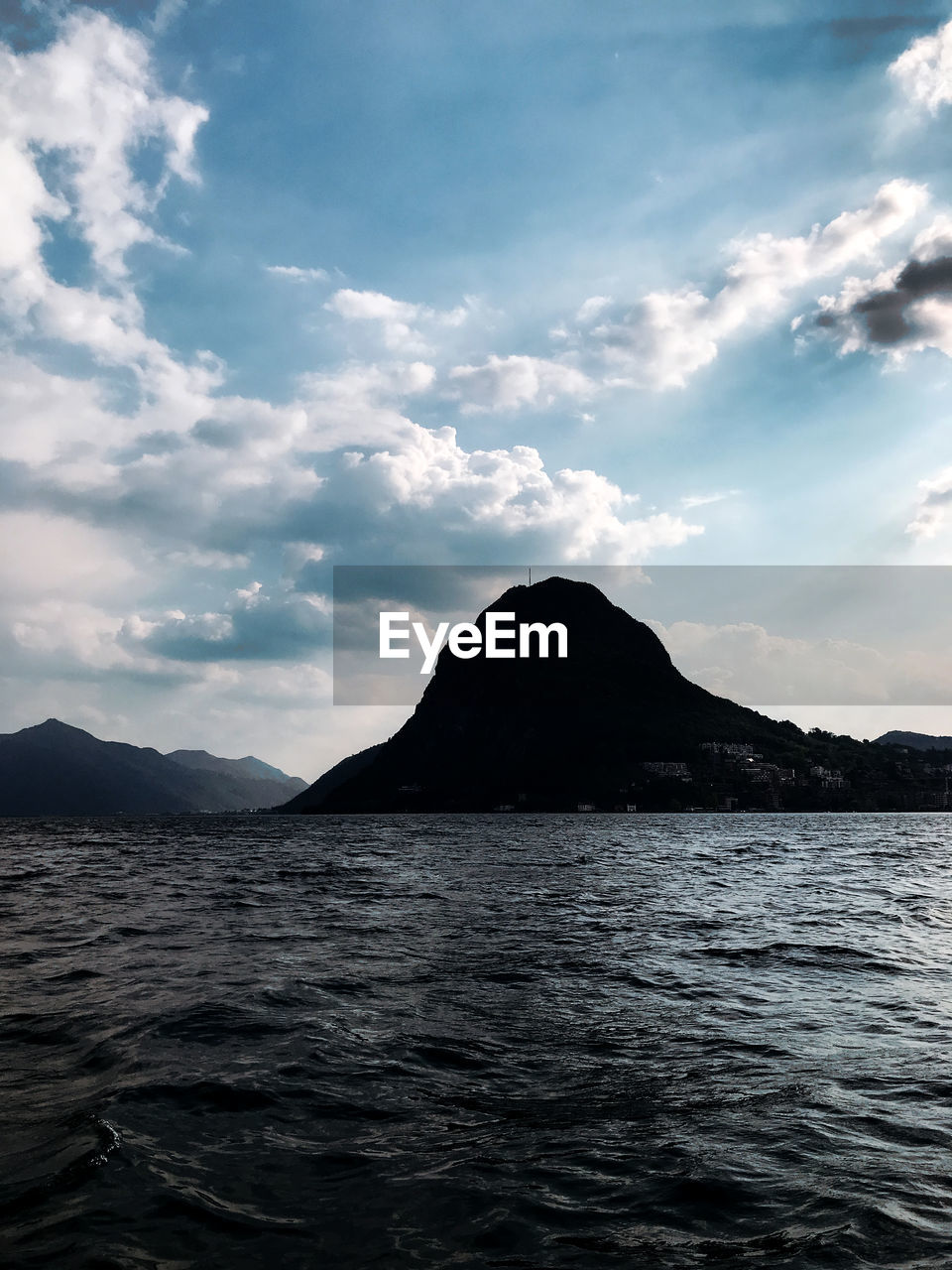 horizon, water, sky, cloud, sea, ocean, mountain, coast, scenics - nature, beauty in nature, nature, environment, land, landscape, shore, no people, body of water, reflection, wave, bay, travel destinations, outdoors, tranquility, travel, tranquil scene, rock, non-urban scene, dramatic sky, dusk, day