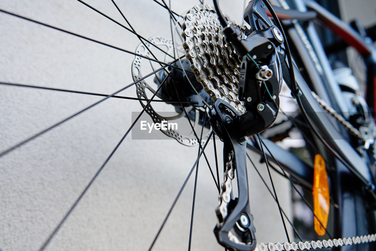 Shifting gears on rear transmission of bicycle. bicycle gear drivetrain and cassette, close up