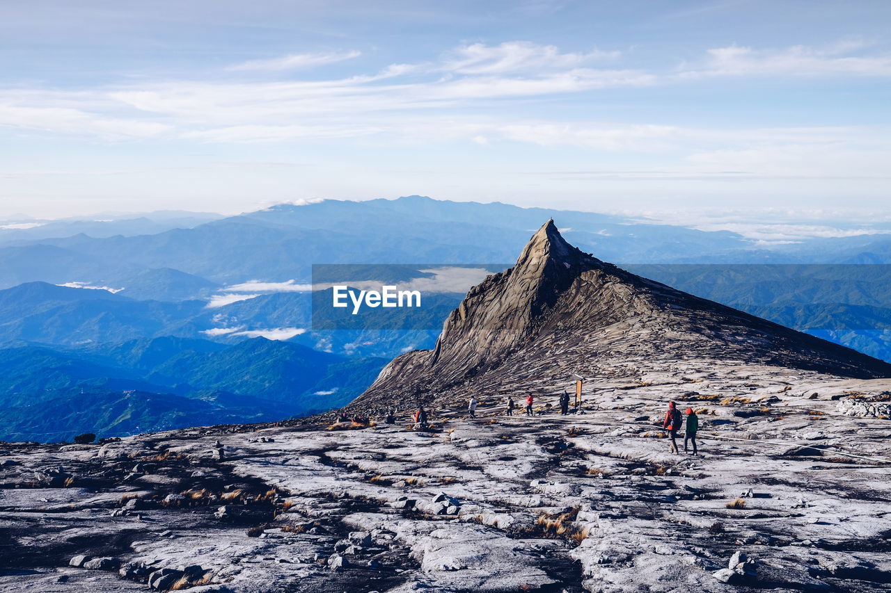 People on mt kinabalu against sky
