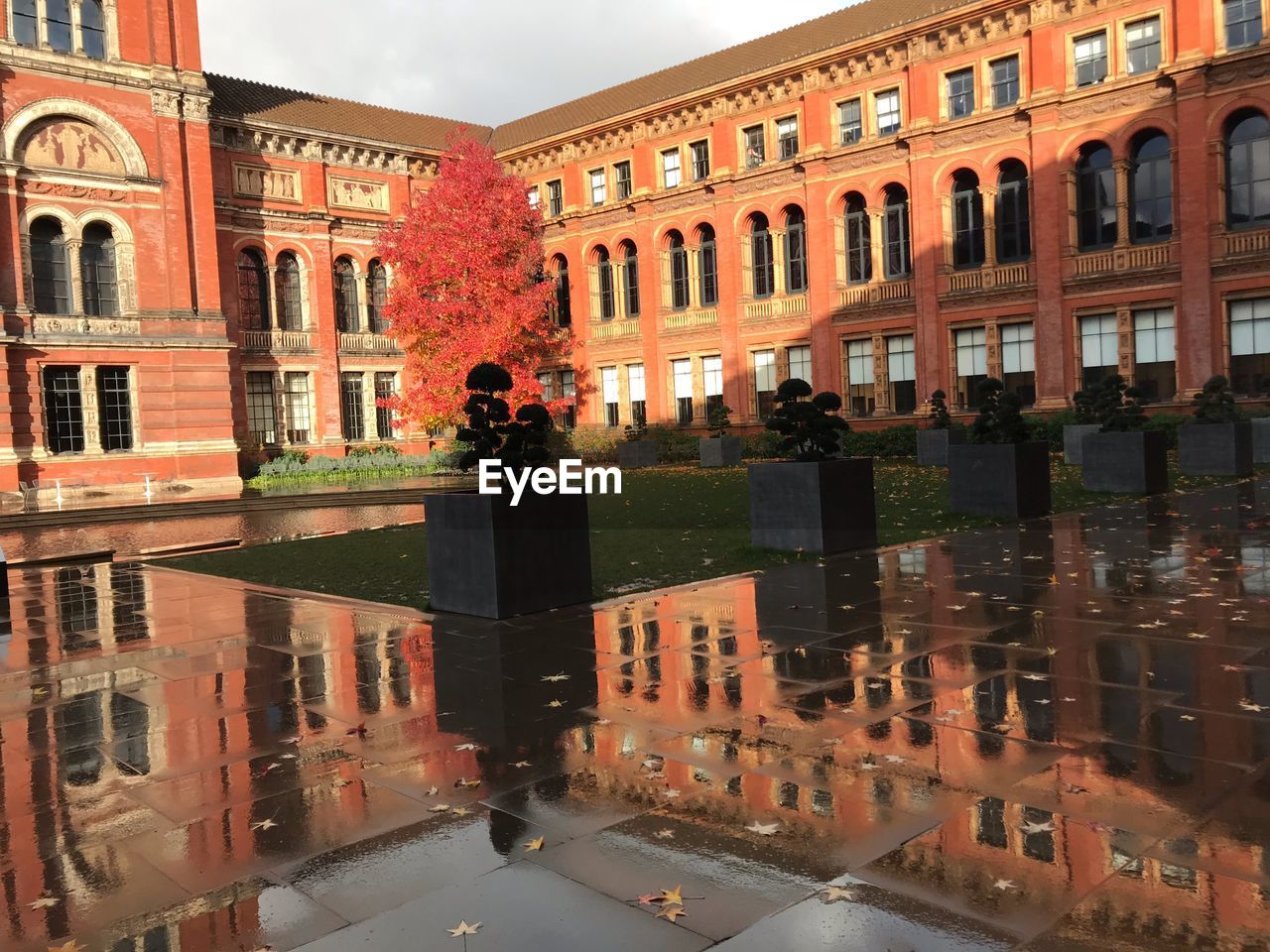 REFLECTION OF BUILDINGS ON GLASS WINDOW