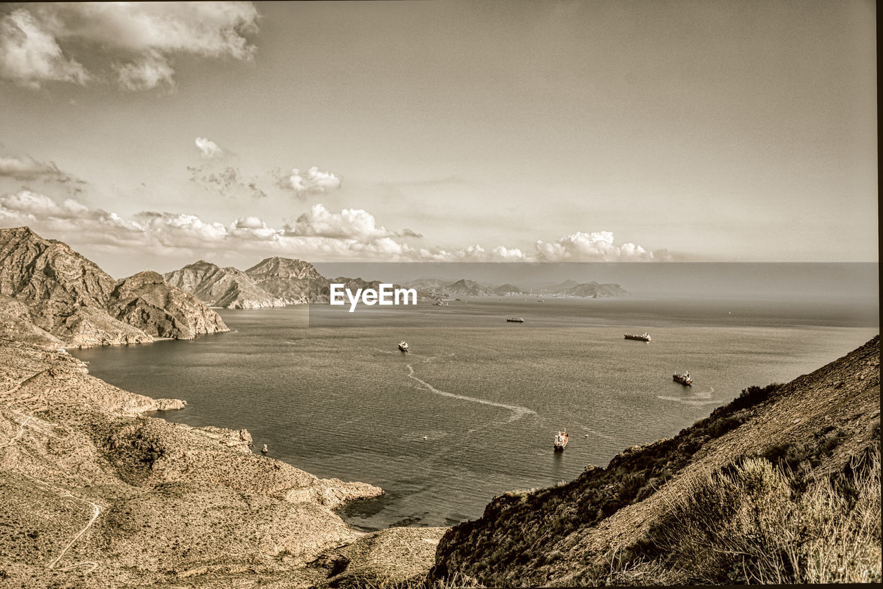 SCENIC VIEW OF BAY AGAINST SKY