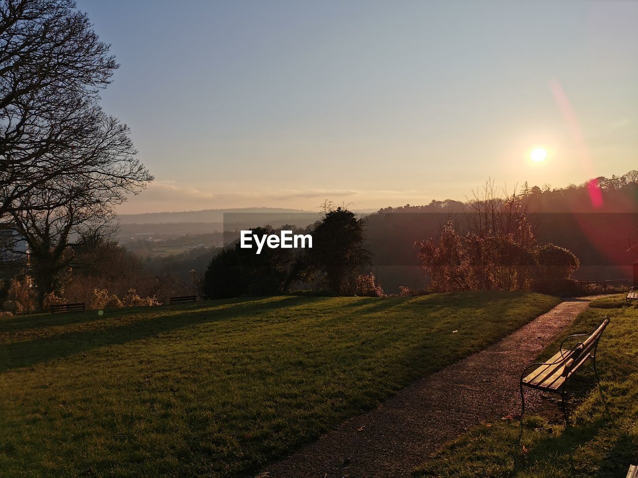 Scenic view of field against sky during sunset