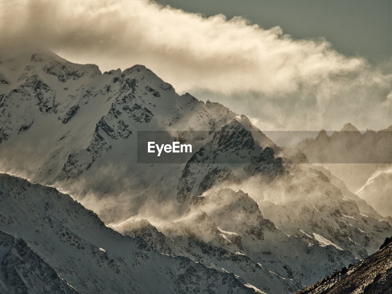 Scenic view of snowcapped mountains against sky