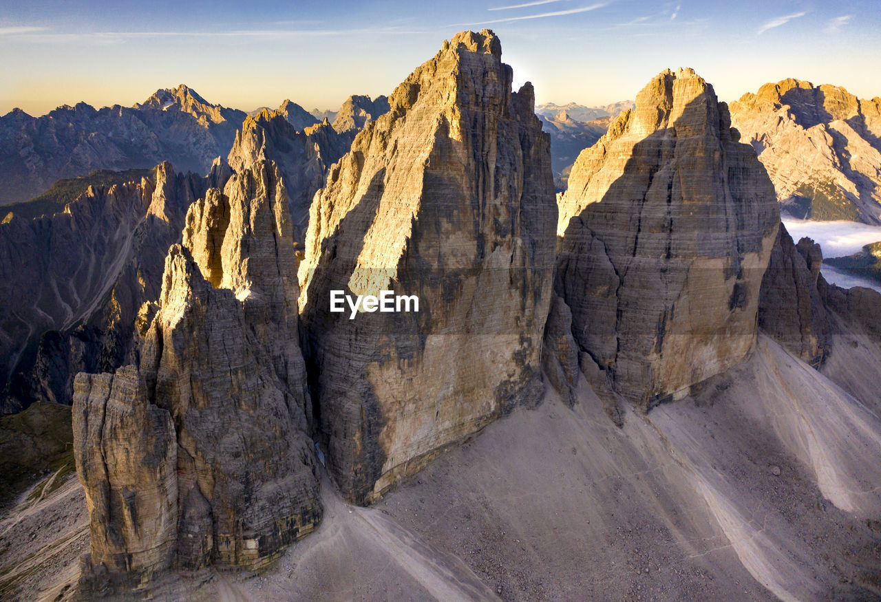 Tre cime di lavaredo - drei zinnen aerial view from above at first light, sesto dolomites