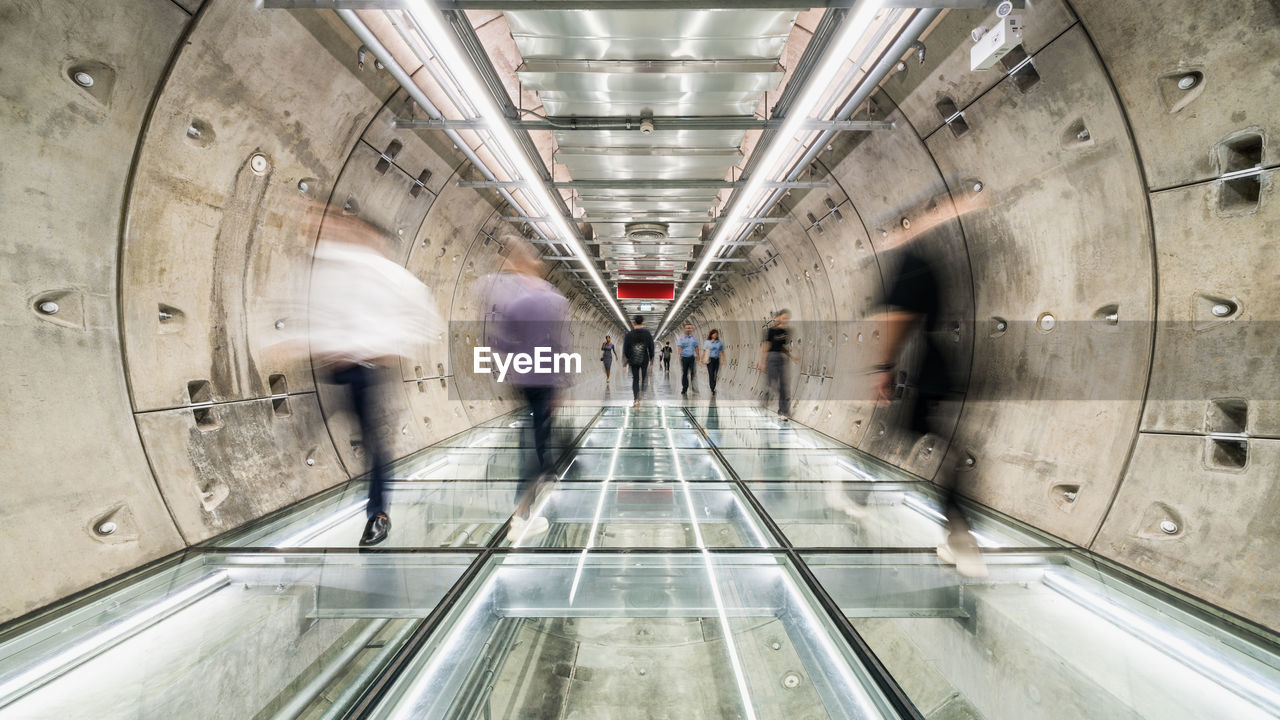 PEOPLE WALKING IN SUBWAY STATION