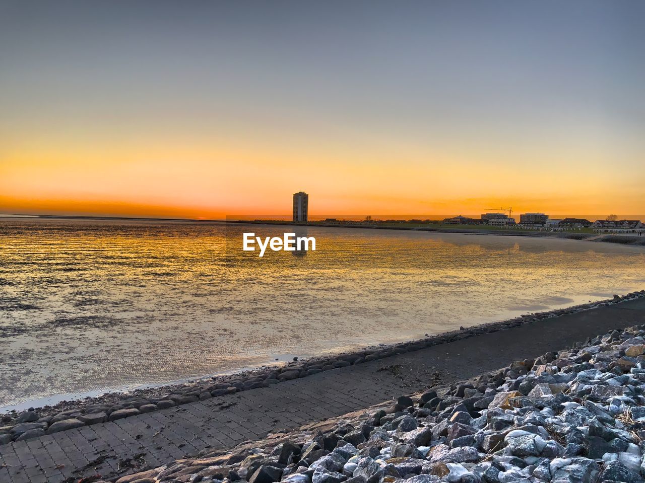 SCENIC VIEW OF BEACH DURING SUNSET