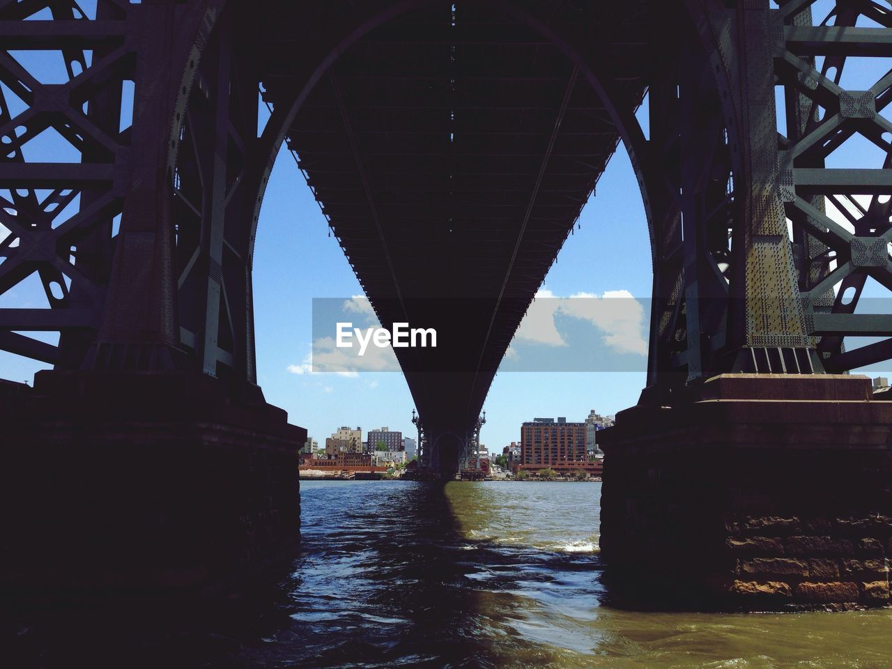 Close up of a strong bridge with metallic structure shot from below