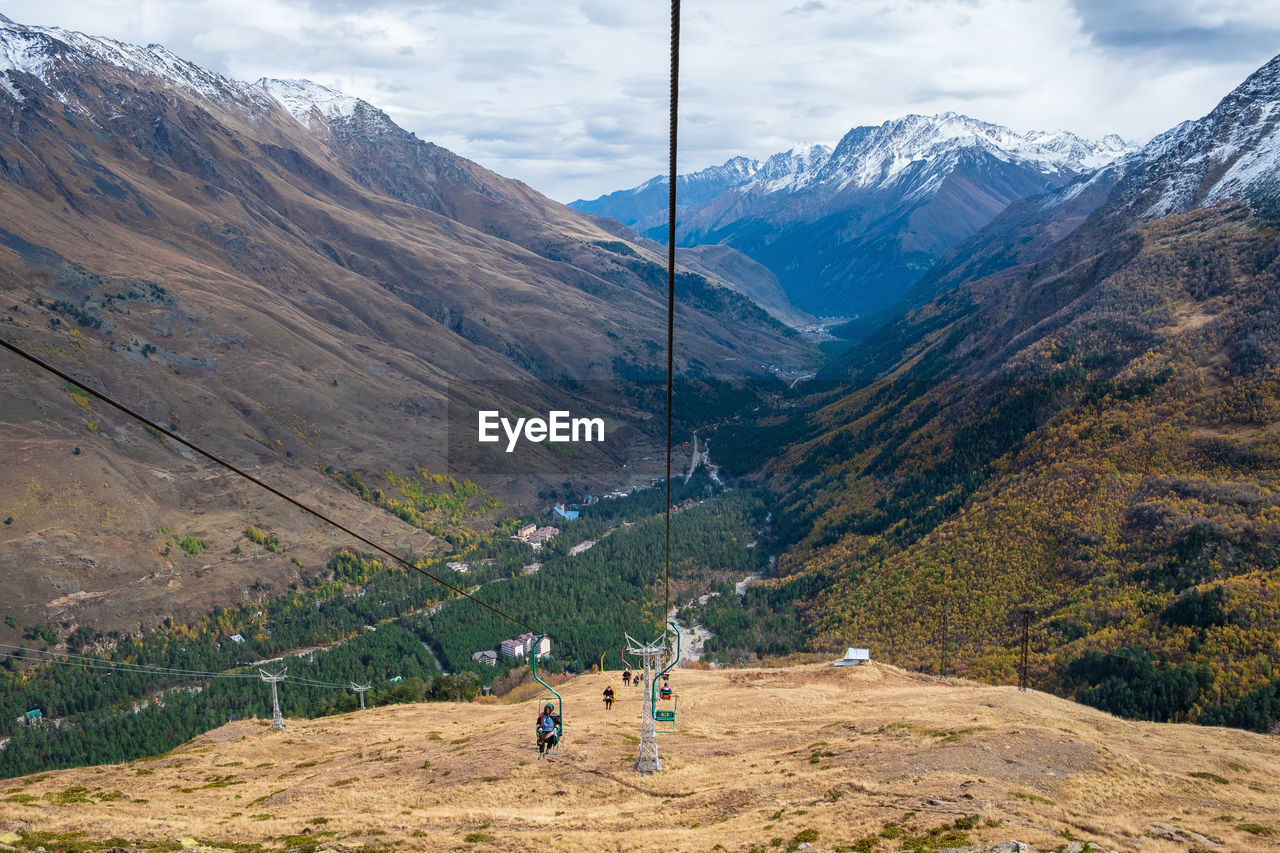 View of the mountain gorge with a single-seat cable car line for tourists, skiers and climbers. 