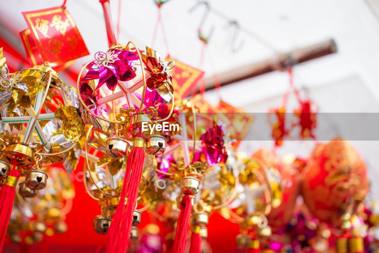 Close-up of chinese new year decoration hanging in shop