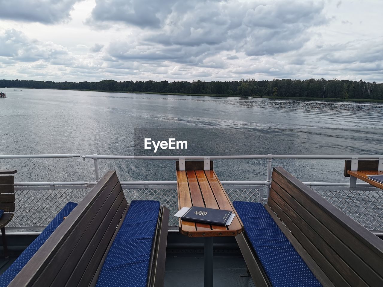 water, dock, sky, cloud, vehicle, nature, nautical vessel, transportation, no people, sea, day, architecture, boat, ship, tranquility, pier, passenger ship, outdoors, travel, scenics - nature, beauty in nature, mode of transportation, railing, travel destinations, tranquil scene, deck, wood, built structure, vacation, environment, trip, boat deck, high angle view