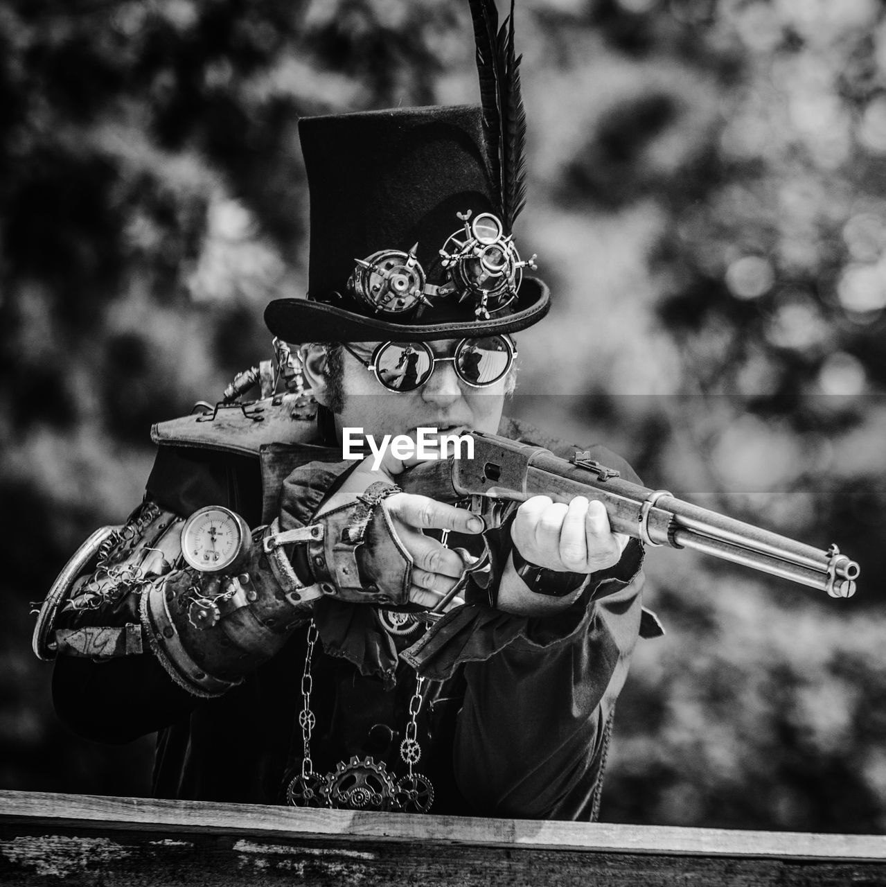 black, black and white, monochrome, monochrome photography, one person, clothing, weapon, adult, arts culture and entertainment, person, outdoors, costume, disguise, nature, day, men, focus on foreground