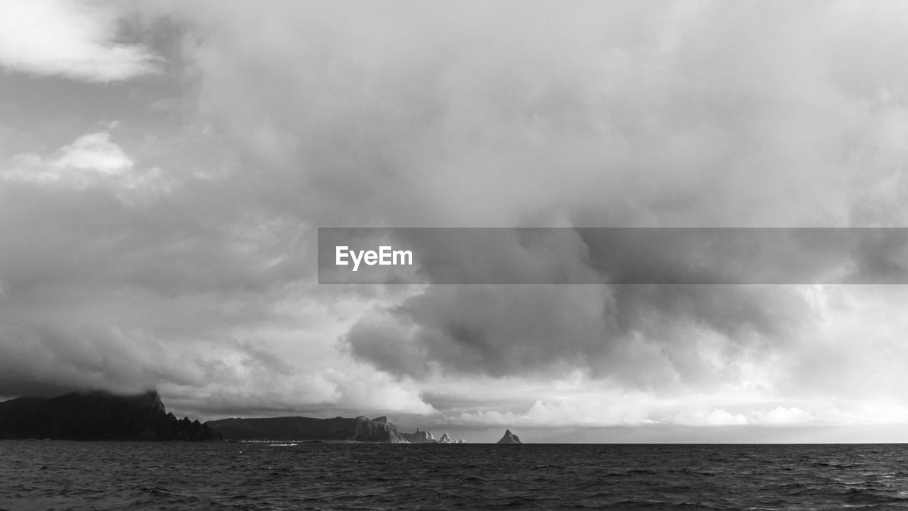 Scenic view of sea against cloudy sky