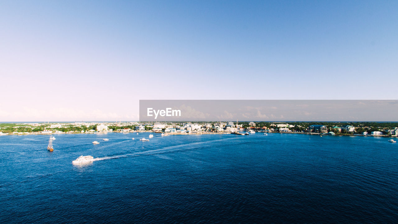 Scenic view of sea against blue sky