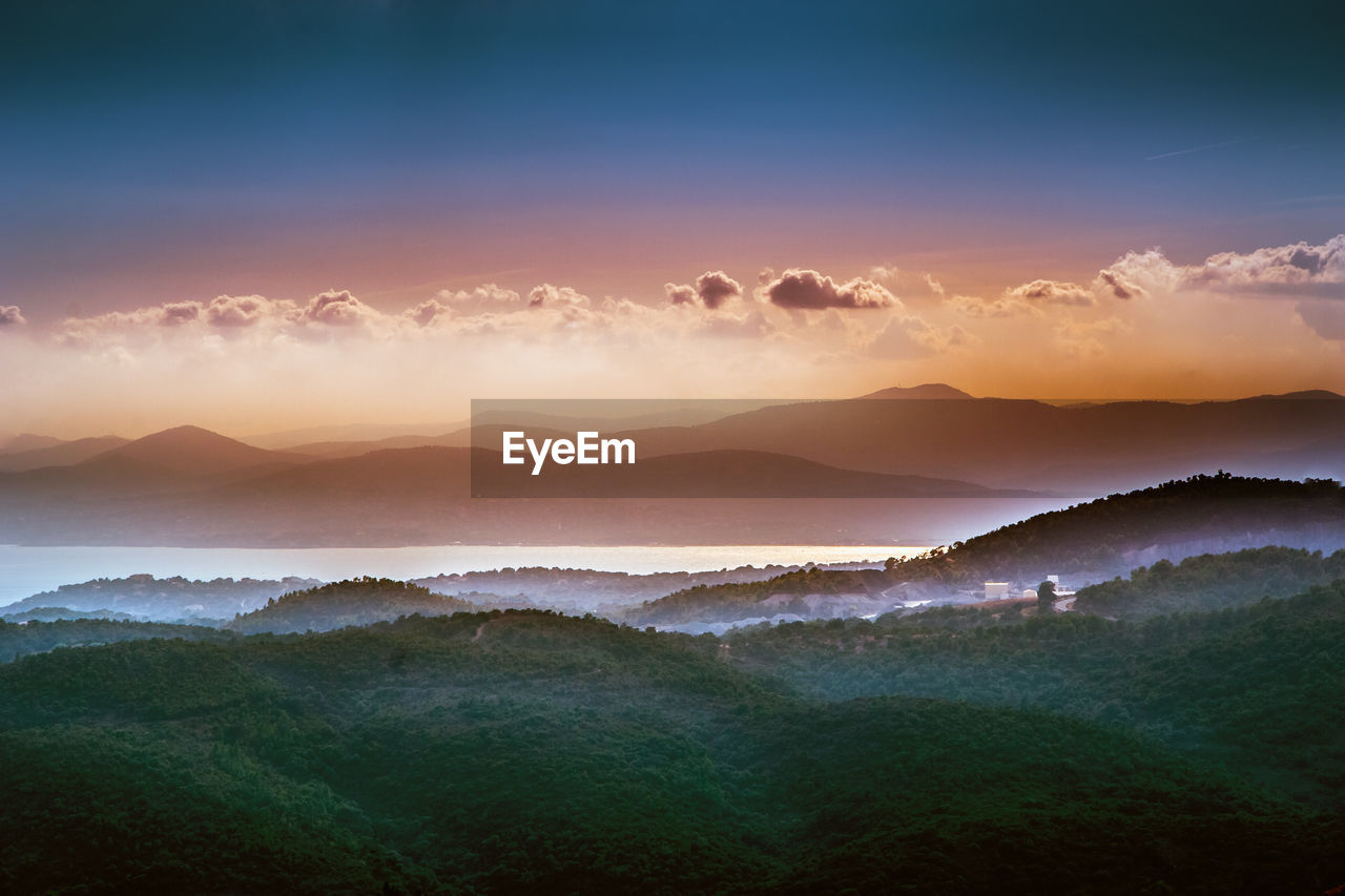 Scenic view of mountains against sky during sunset