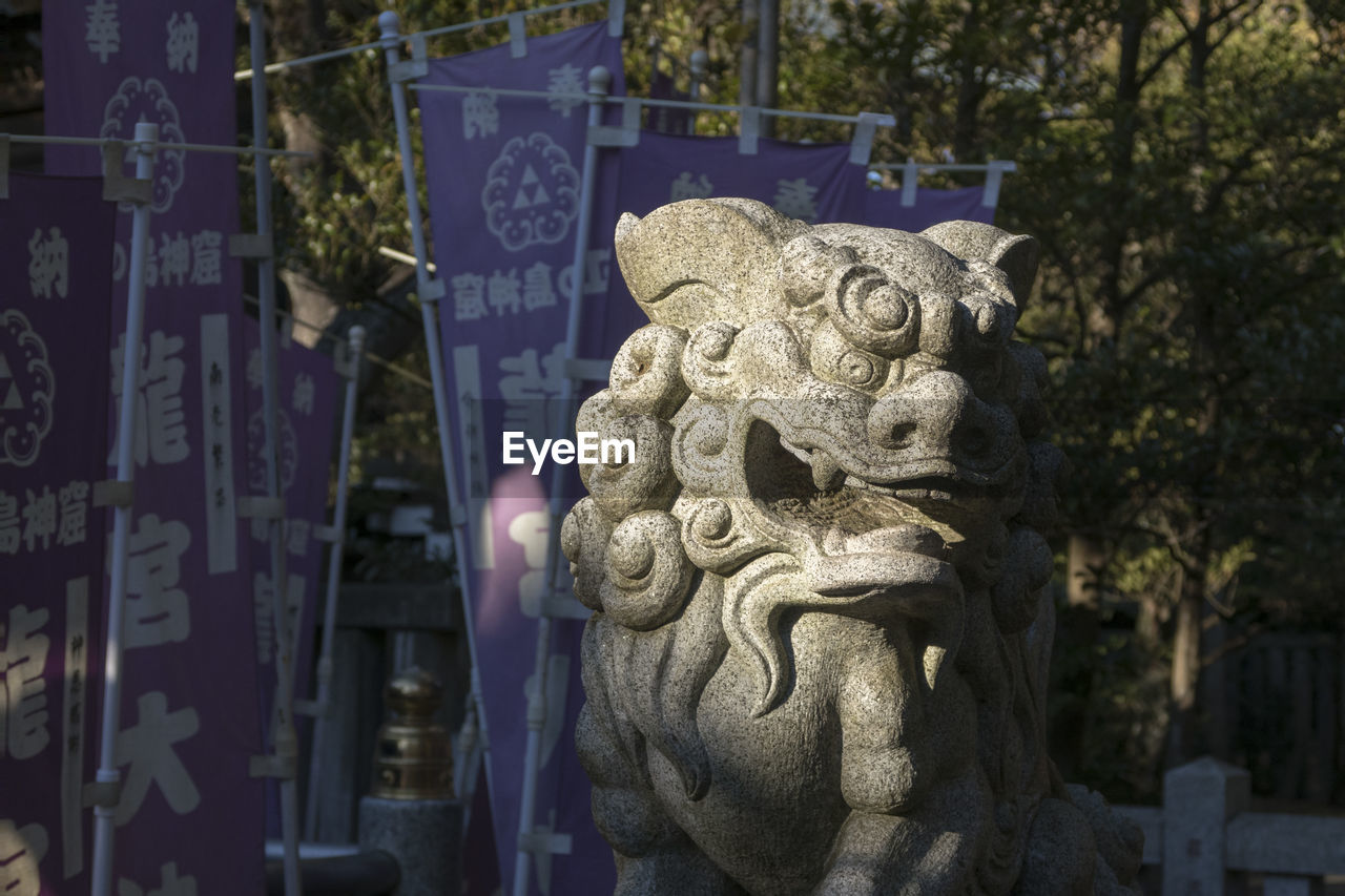 CLOSE-UP OF BUDDHA STATUE