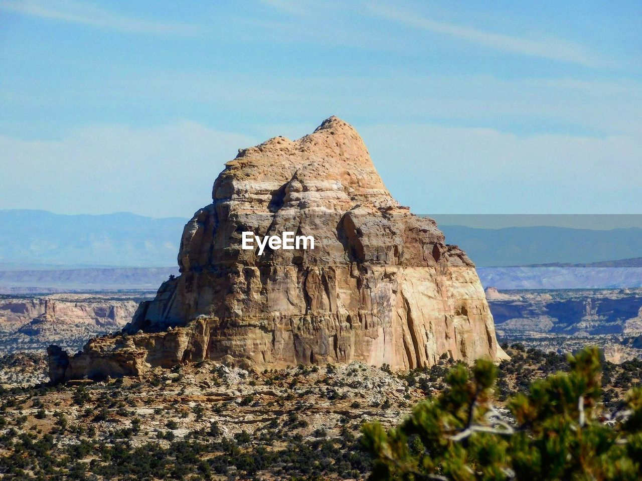 Rock formations on landscape against sky