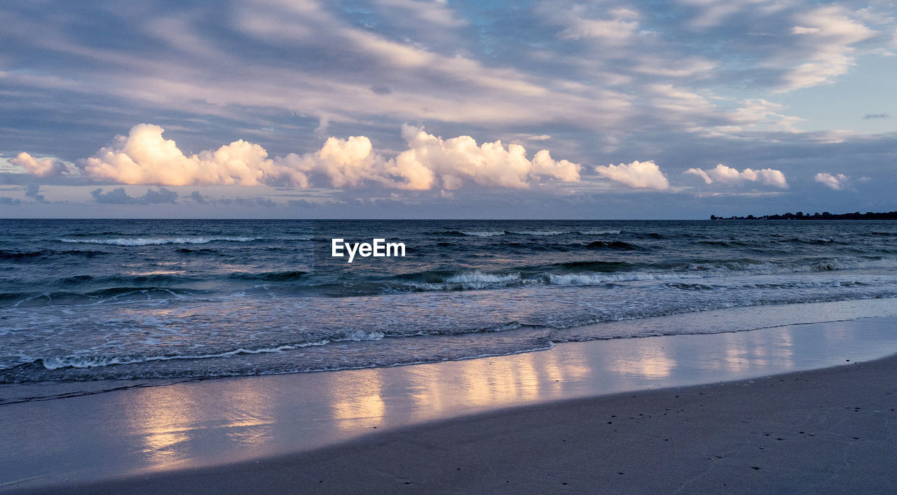 Scenic view of beach against sky