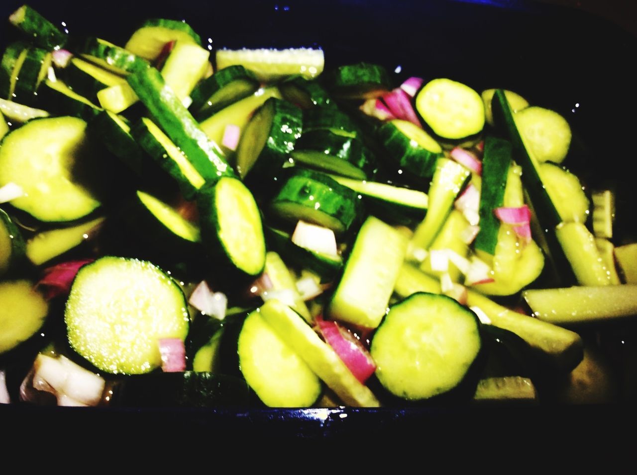 Close-up of sliced cucumbers on table