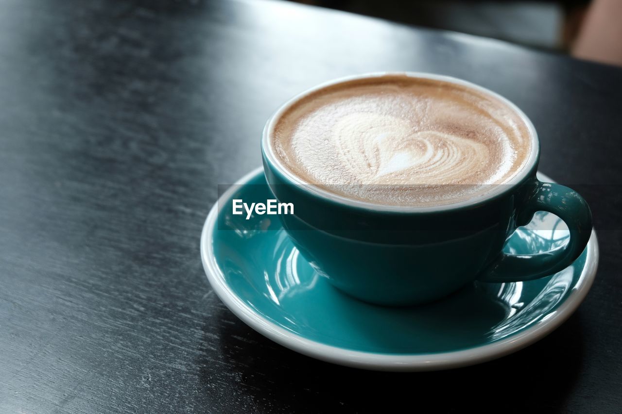 CLOSE-UP OF COFFEE ON TABLE