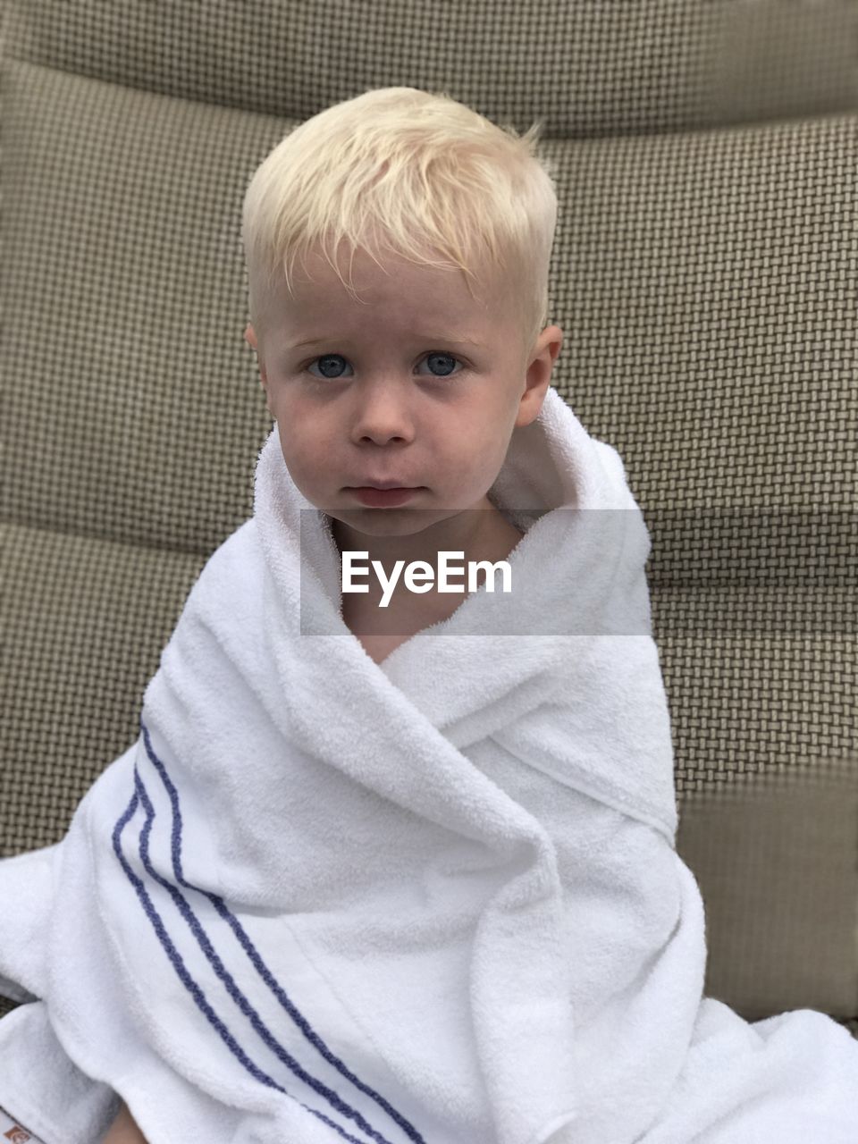 Portrait of boy wearing white towel