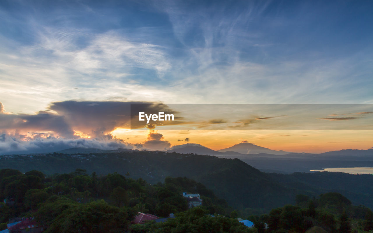 SCENIC VIEW OF MOUNTAINS DURING SUNSET