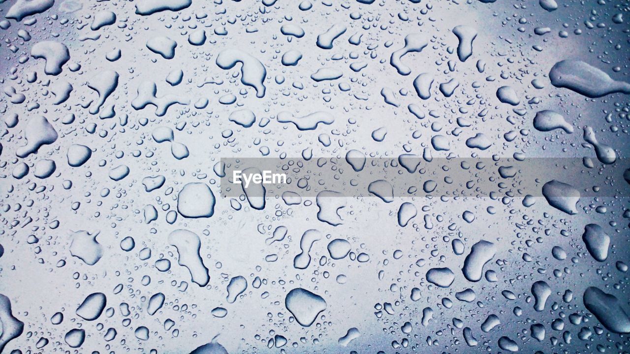 Full frame shot of water drops on rainy day