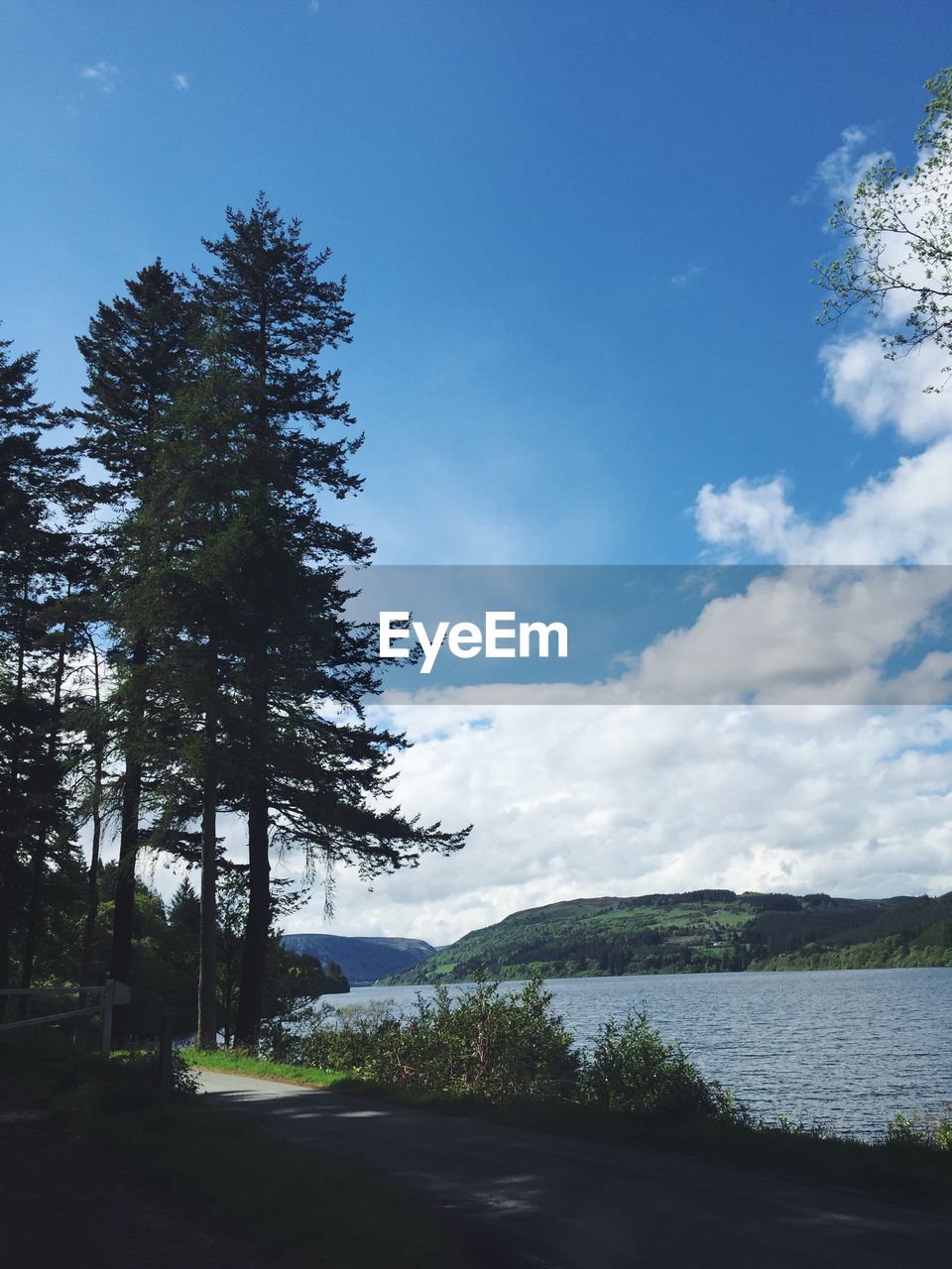 Scenic view of landscape against blue sky