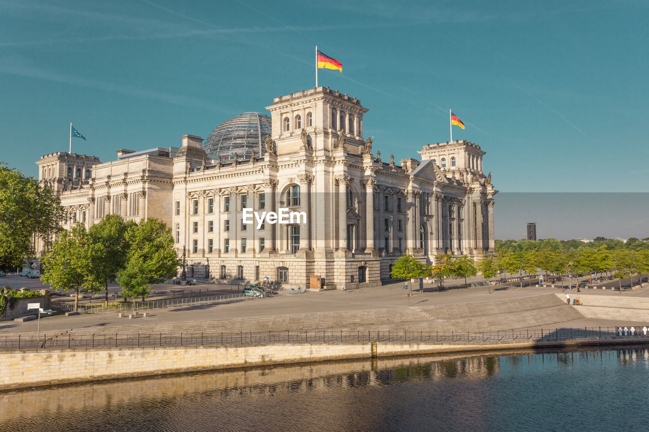 River by the reichstag against blue sky