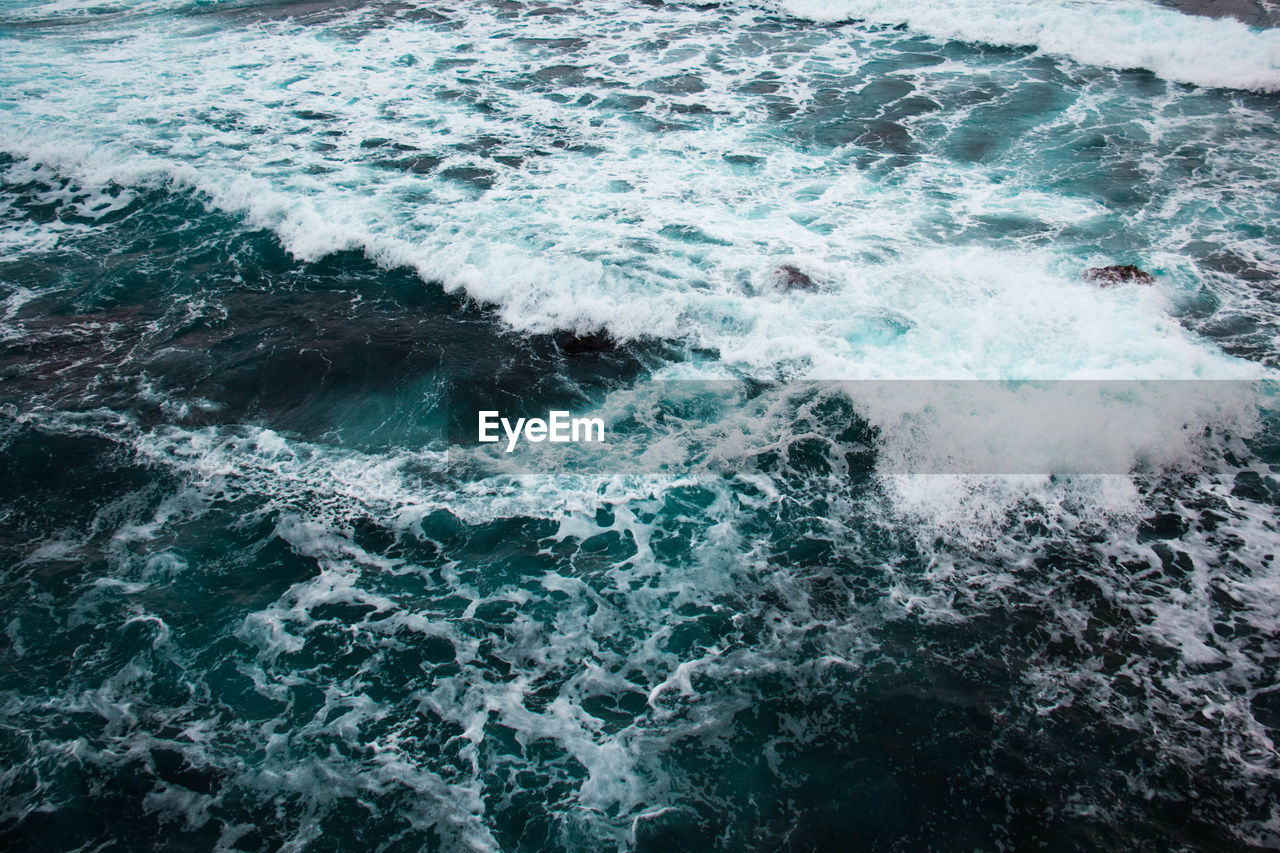 High angle view of waves in sea