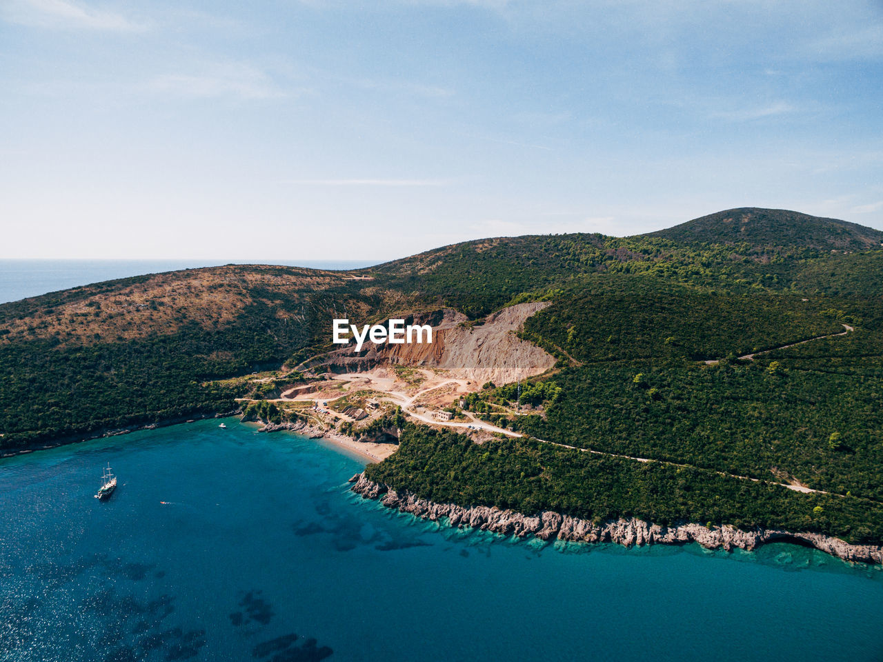 HIGH ANGLE VIEW OF BAY AGAINST CLEAR SKY