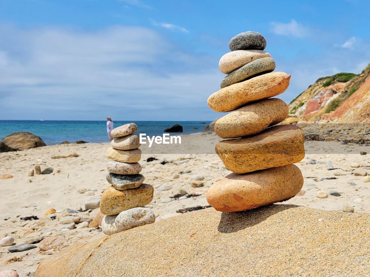 Stacked rocks on beach.