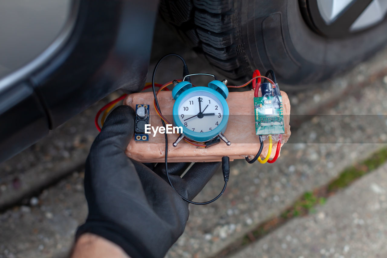 Vehicle bomb being placed by terrorist