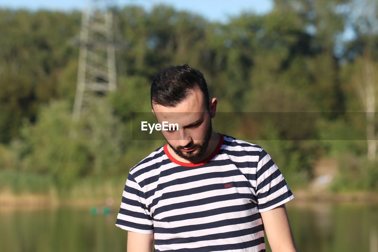 Young man standing outdoors