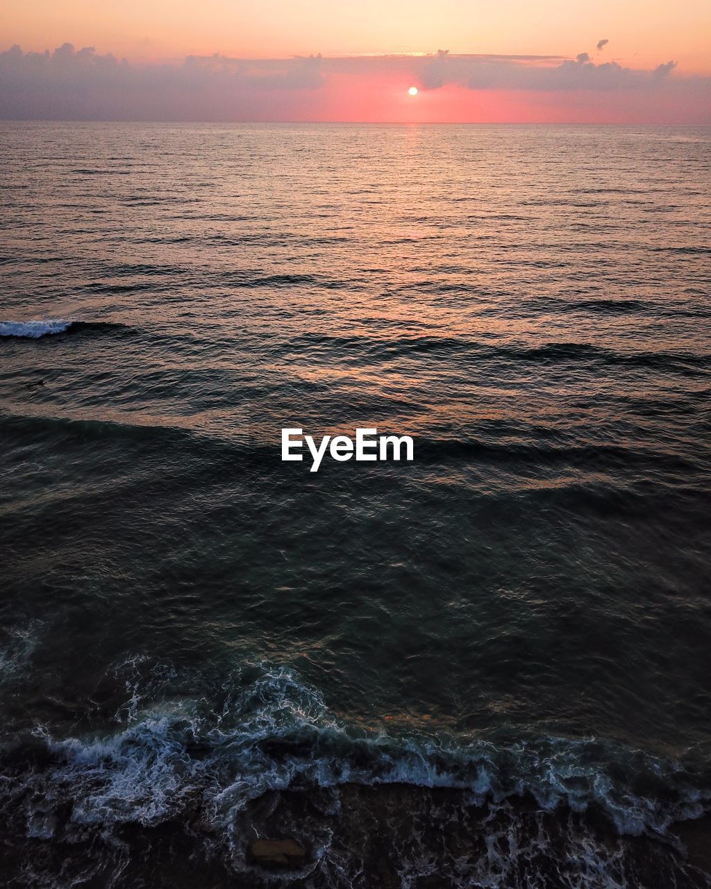 SCENIC VIEW OF SEA DURING SUNSET