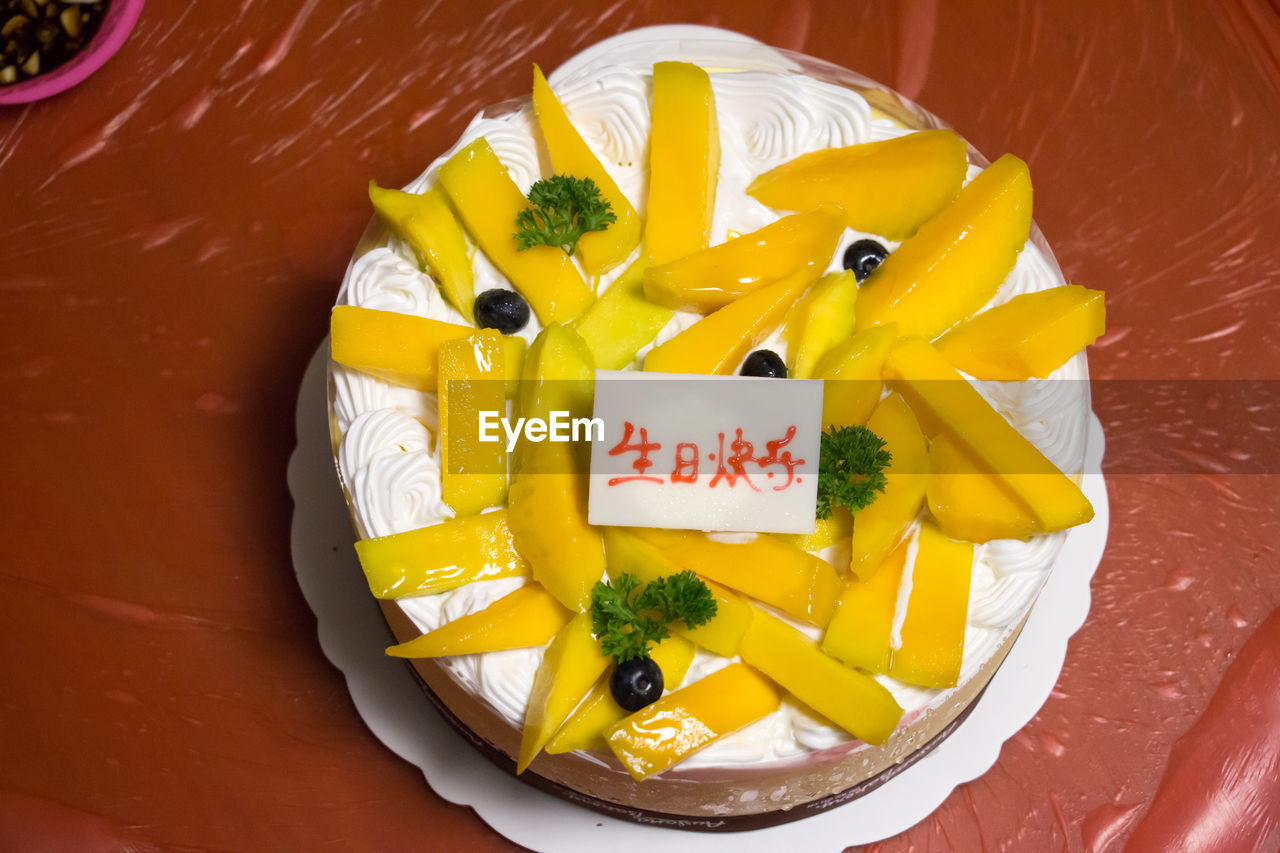 High angle view of fresh fruitcake with label